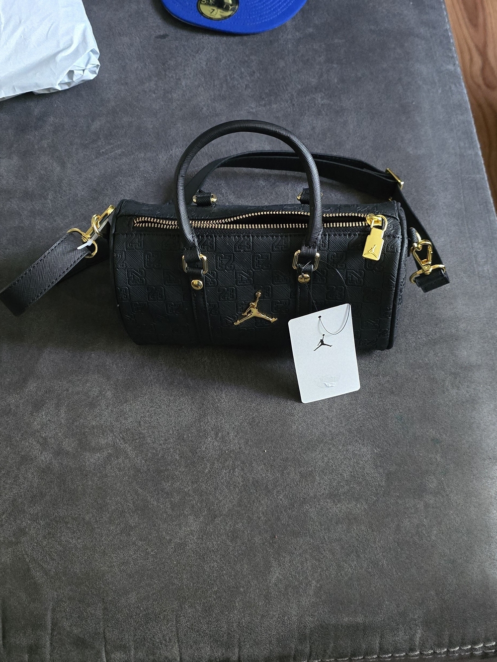 A black Jordan Monogram Mini Duffle Bag With Jump Man On It - Picture 7 of 10